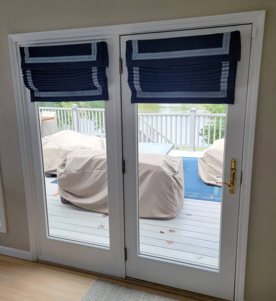 Roman shades installed on french doors.