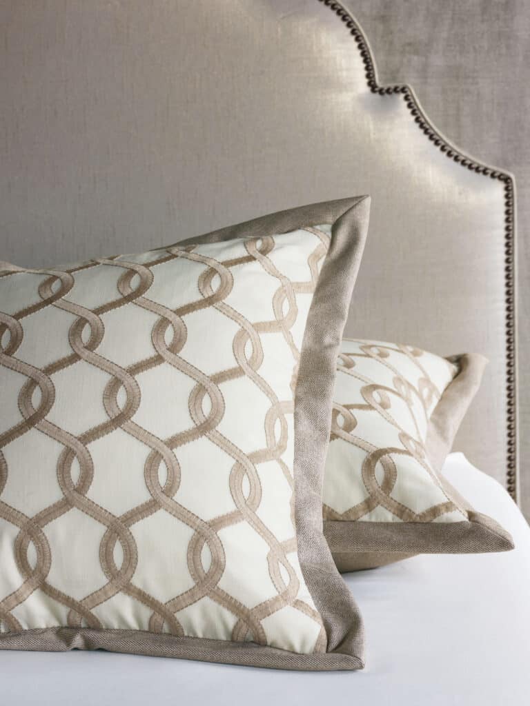 detail of custom accent pillows with looping design