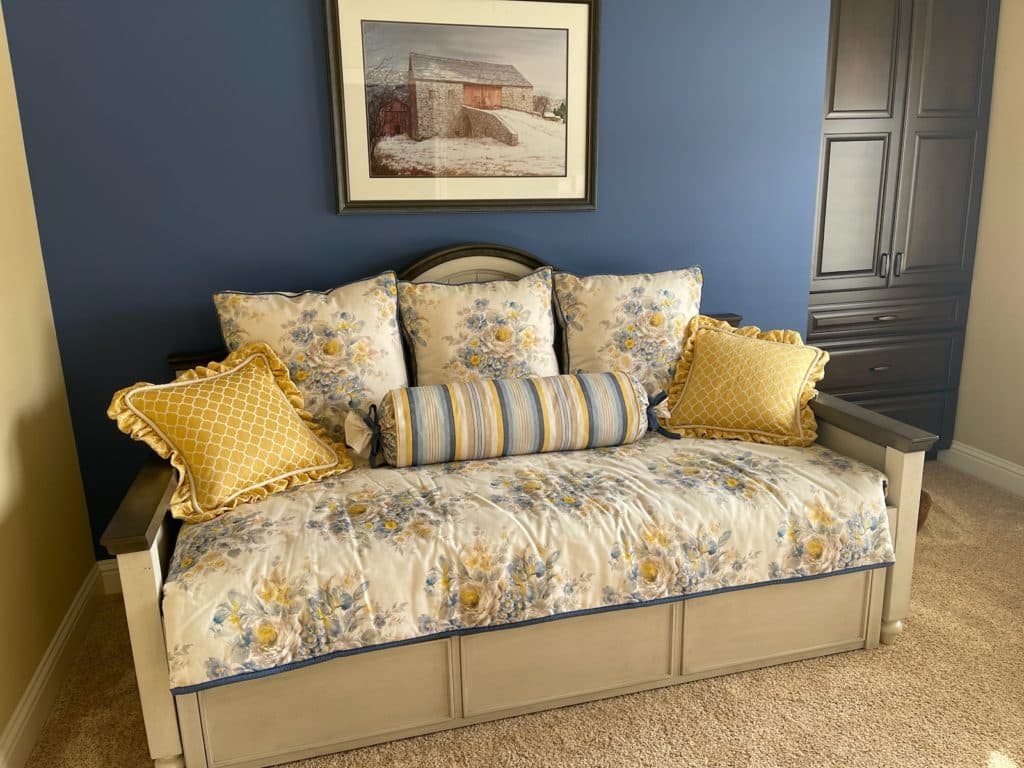 Custom set of decorative pillows in blue and yellow floral and matching blanket