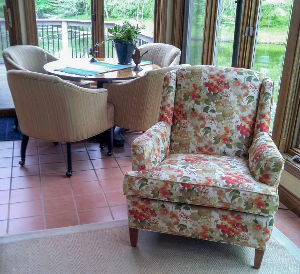 custom reupholstered armchair and dining chairs